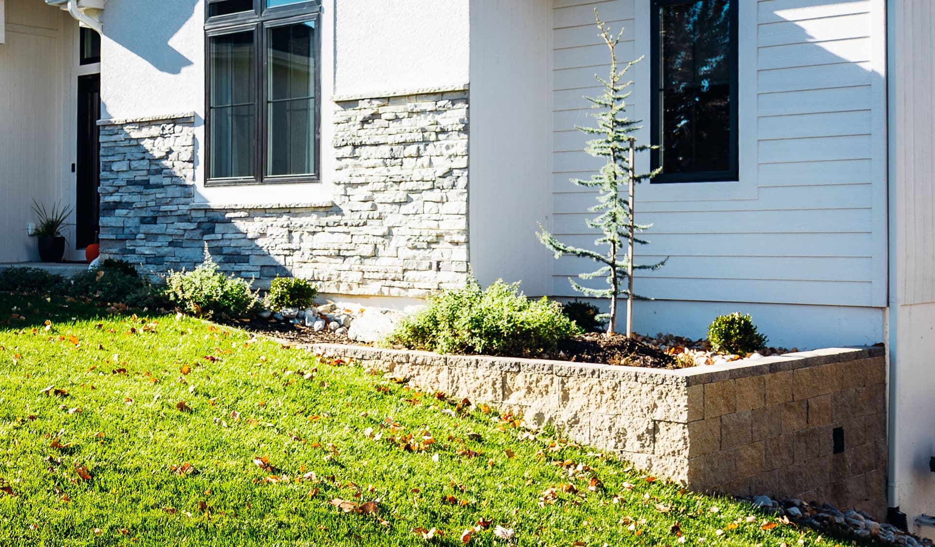 Elevated Outdoor Spaces with Retaining Walls and Pavers in Shawnee KS